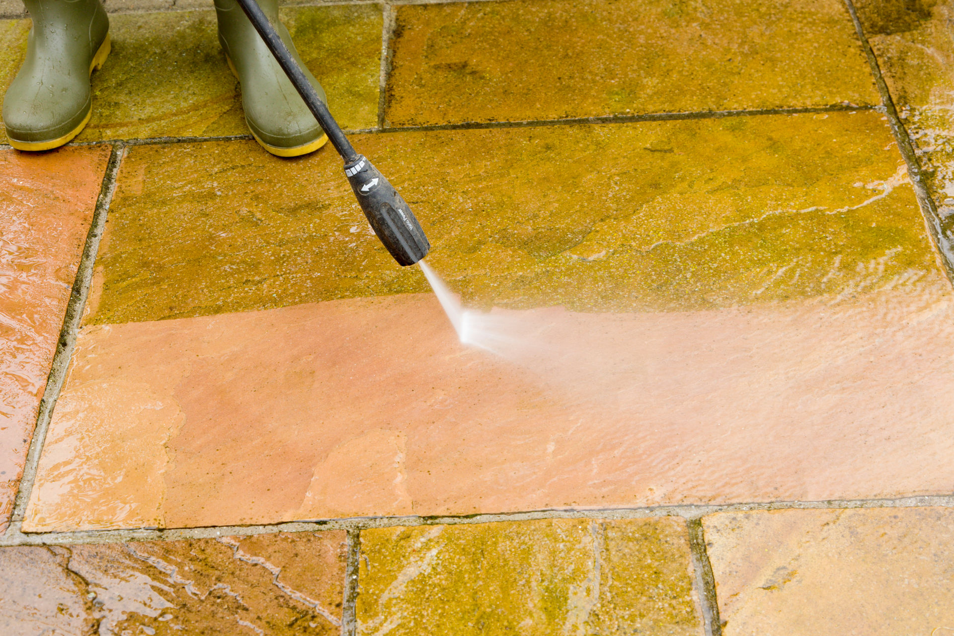 Pressure washing a driveway